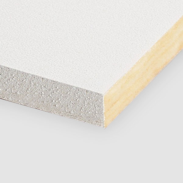 A close-up of the corner of a rectangular, white laminated board showing its layered structure with a smooth white surface and a wooden core. The background is plain and light gray.