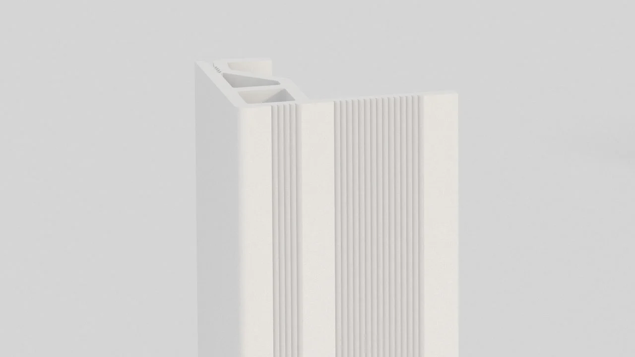 A close-up of a white, rectangular plastic or metal extrusion with vertical grooves and a hollow interior, set against a light grey background.