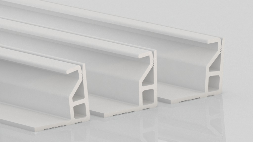 Three white aluminum extrusions with an angular, geometric profile are arranged side by side on a reflective surface. Each extrusion appears to have a slightly different width but similar shape.