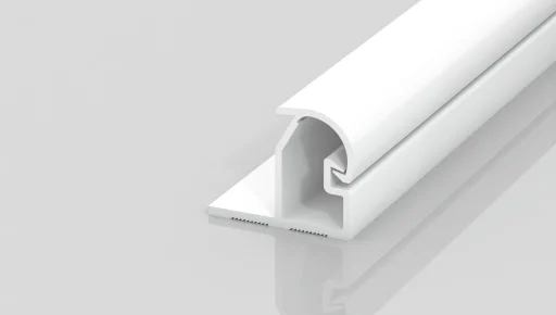 A white, L-shaped plastic or metal trim piece with a flat base and a rounded top is shown on a plain light gray background. The trim features a grooved inner section and smooth surfaces.