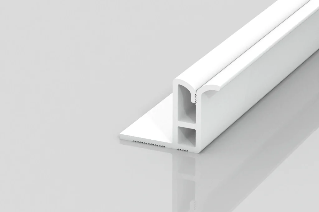 A white, L-shaped plastic or metal extrusion profile with hollow channels and a flat base, displayed on a reflective light gray surface.