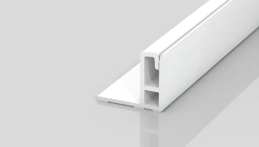 A white, L-shaped plastic trim piece with two rectangular inner channels, shown on a glossy, light gray surface. The trim has one long flat section and one upright section forming a right angle.