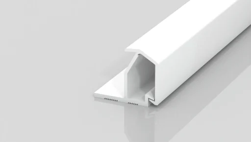A white, rectangular plastic trim piece with a flat base and grooved inner section, shown on a reflective light gray surface.