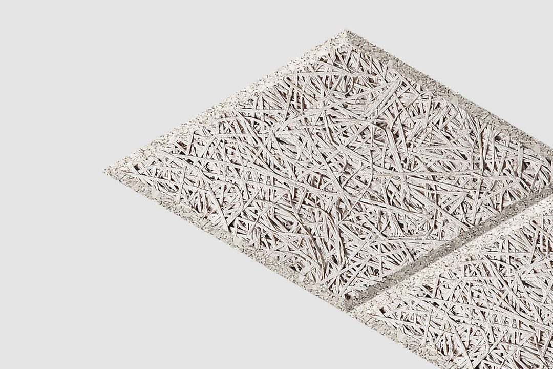 Two square ceiling tiles with a rough, interwoven wood fiber texture are positioned diagonally on a plain white background.