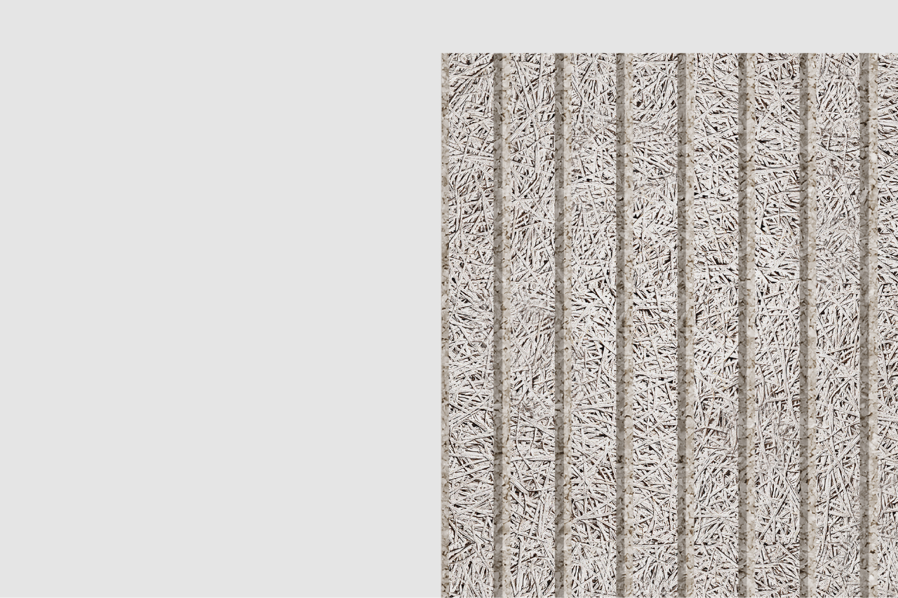 A rectangular panel made of compressed straw or wood fibers with vertical grooves, placed against a plain light gray background. The texture appears rough and fibrous.